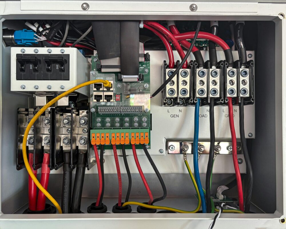 Inside view of an electrical control panel showing circuits and connections.